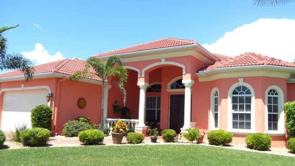 peace and white exteriors with well manicured garden